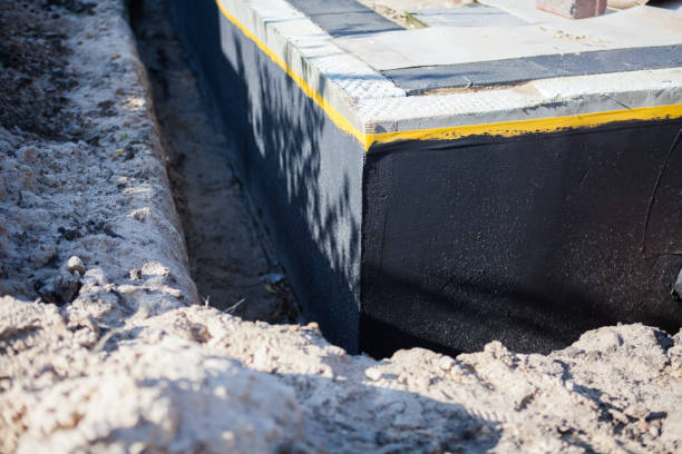Professional Basement Waterproofing technician working in Hannibal, NY